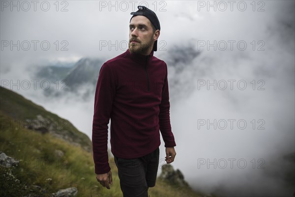 Young man hiking in Swiss Alps