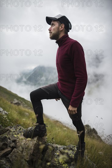Young man hiking in Swiss Alps
