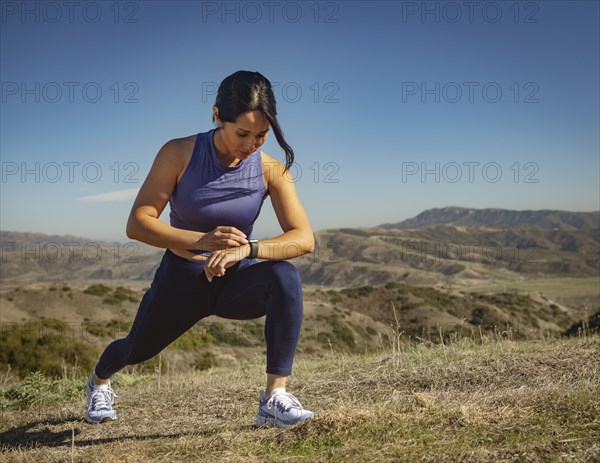 Woman stretching in landscape