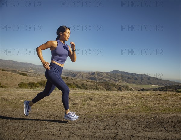 Woman jogging in landscape