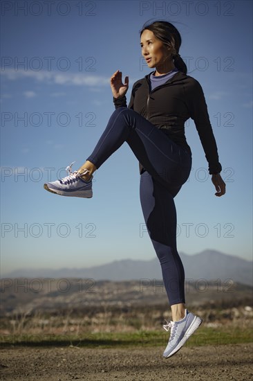 Woman exercising in landscape