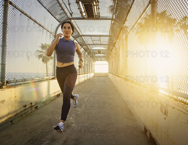 Woman jogging at sunset