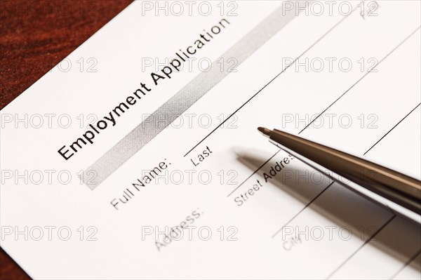 Job application form and pen