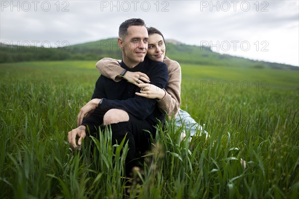 Young couple embracing in wheat field