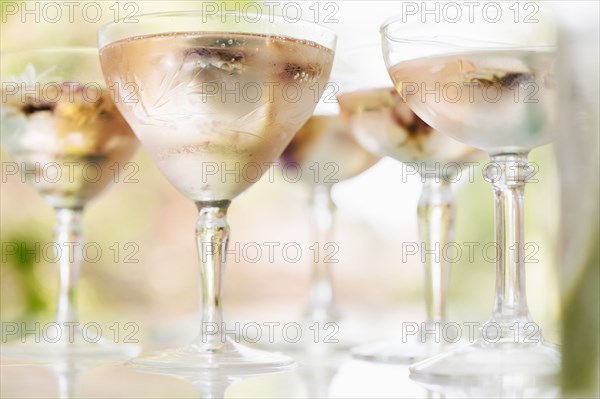 Sparkling rose wine with edible flower garnish