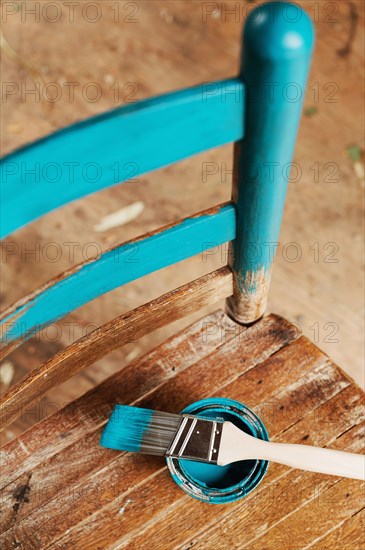Old wooden chair with turquoise paint