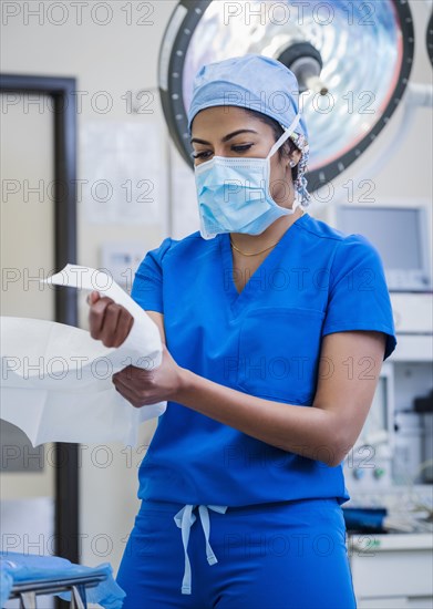 Female doctor preparing for surgery in operating theater