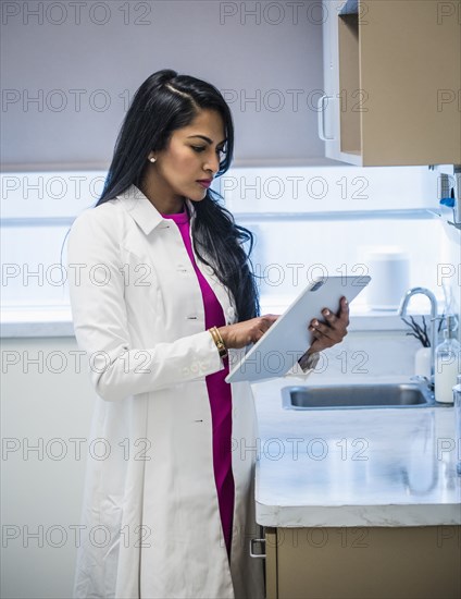 Female doctor with medical documents