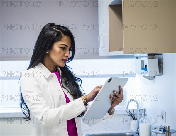 Female doctor with medical documents