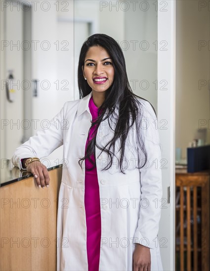 Portrait of female doctor at reception desk