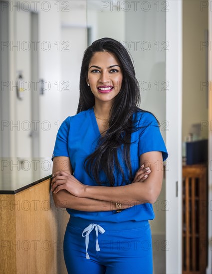 Portrait of female doctor at reception desk