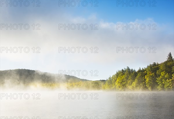 Usa, New York State, North Elba, Morning fog over Placid Lake