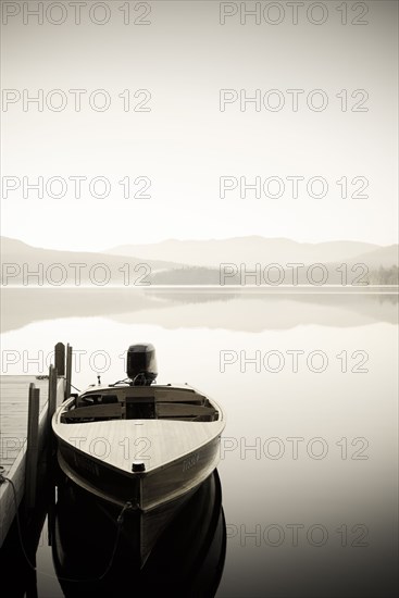 Usa, New York, North Elba, Wooden boat docked on Lake Placid