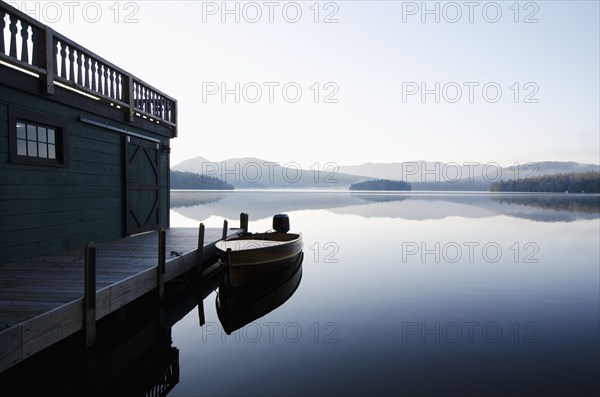 Usa, New York, North Elba, Wooden boat docked on Lake Placid