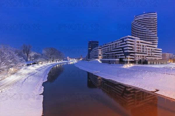 Poland, Subcarpathia, Rzeszow, Modern office buildings next to river