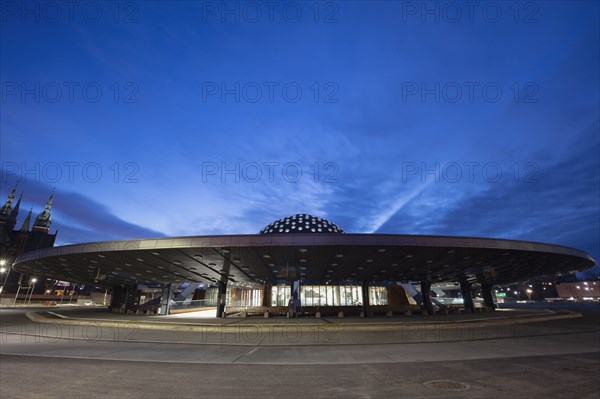 Poland, Holy Cross, Kielce, Exterior of bus station at dusk