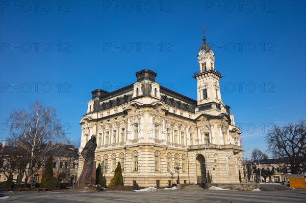 Poland, Lesser Poland, Nowy Sacz, Town hall at town square with sculptured monument