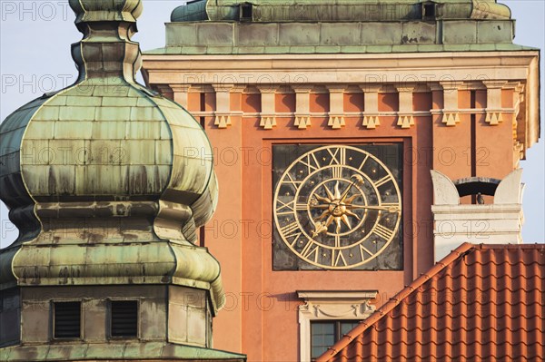 Poland, Masovia, Warsaw, Clock face on castle tower in old town