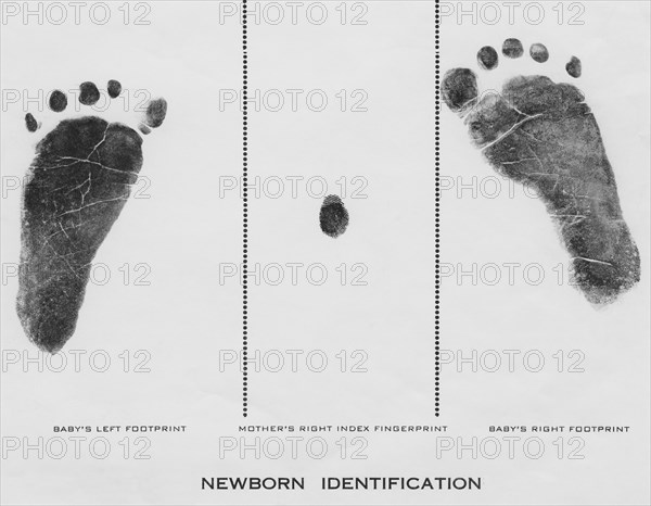 Footprint made with ink on paper of both feet new born infant girl
