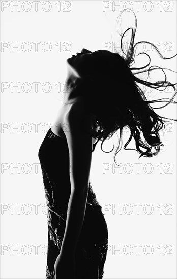 Profile of woman with long wavy hair