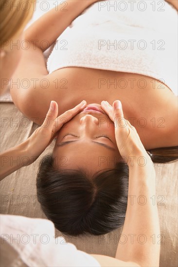 Woman receiving head massage