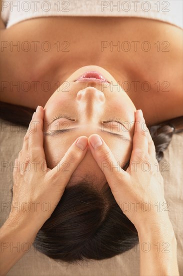 Woman receiving head massage