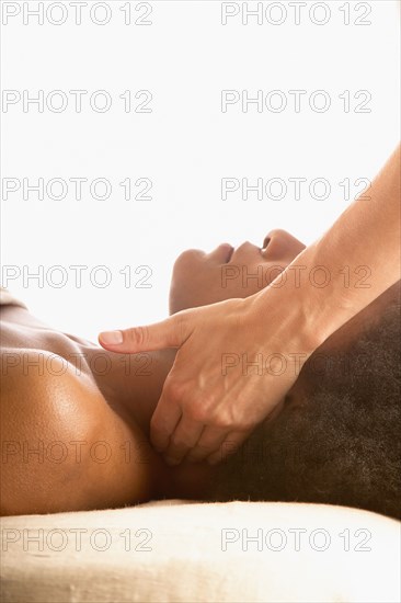 Close-up of woman receiving neck massage