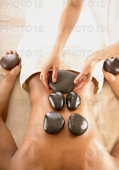 Woman receiving stone massage