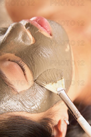 Close-up of woman with facial mask