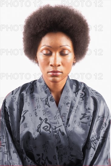 Studio portrait of woman with eyes closed