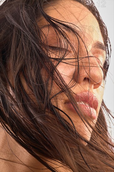 Close-up of woman with brown long hair