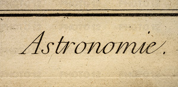 Word Astronomie written in antique script on old textured paper
