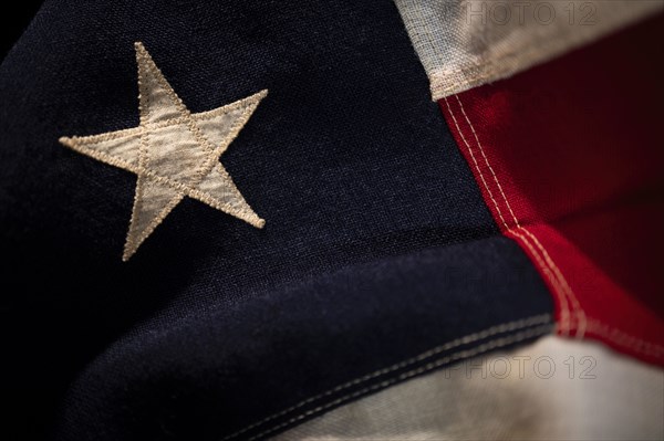 Close-up of star on retro American flag