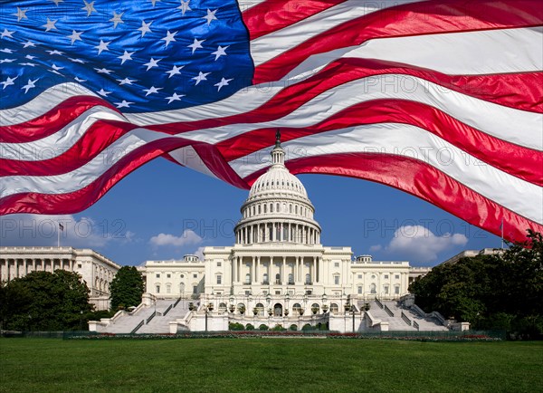 American flag waving over Capital Building