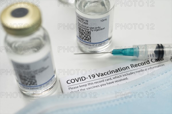 Syringe on Covid-19 vaccination record card