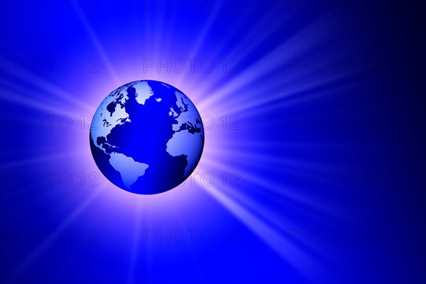 Globe on blue background with burst of light