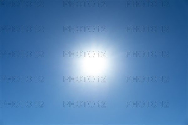 Bright sunburst in blue sky