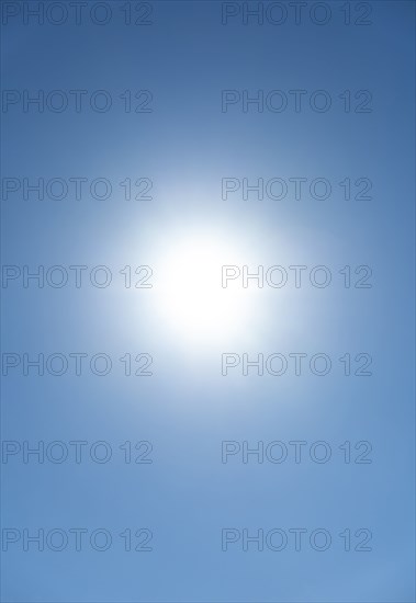 Bright sunburst in blue sky