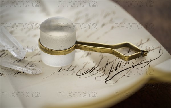 Stanhope magnifier with crystals on antique letter
