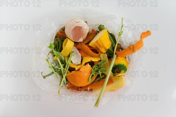 Overhead view of kitchen scraps in compost bin