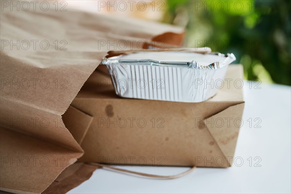Close-up of take out food containers on table