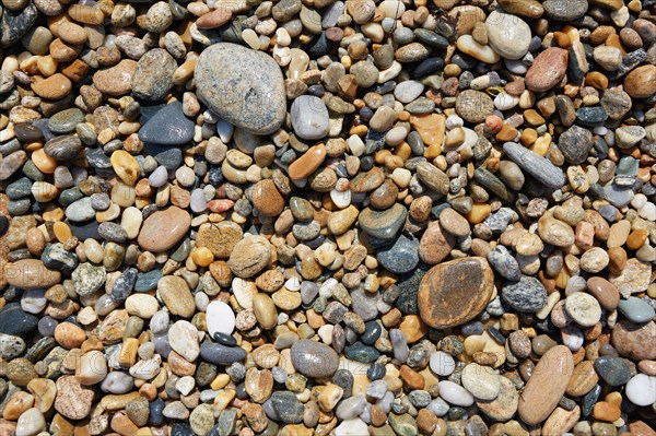 Overhead view of wet stones on beach