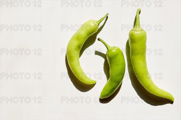 Studio shot of three banana peppers