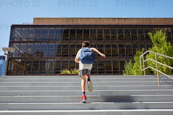 Rear view of boy with backpack