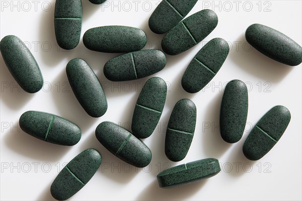 Studio shot of green pills