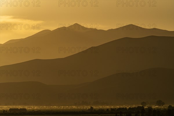 Silhouettes of mountains at sunset