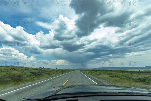 Highway under stormy sky