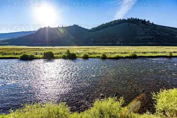 Early morning sun reflecting in Salmon River