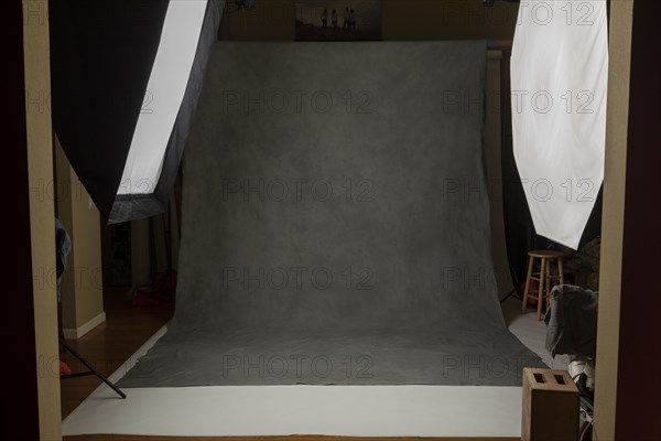 Photo studio set with lightboxes and painted muslin background