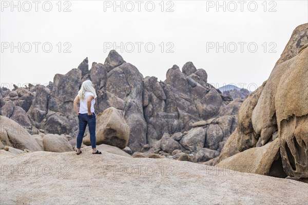 Woman looking at Alabama Hills in Sierra Nevada Mountains